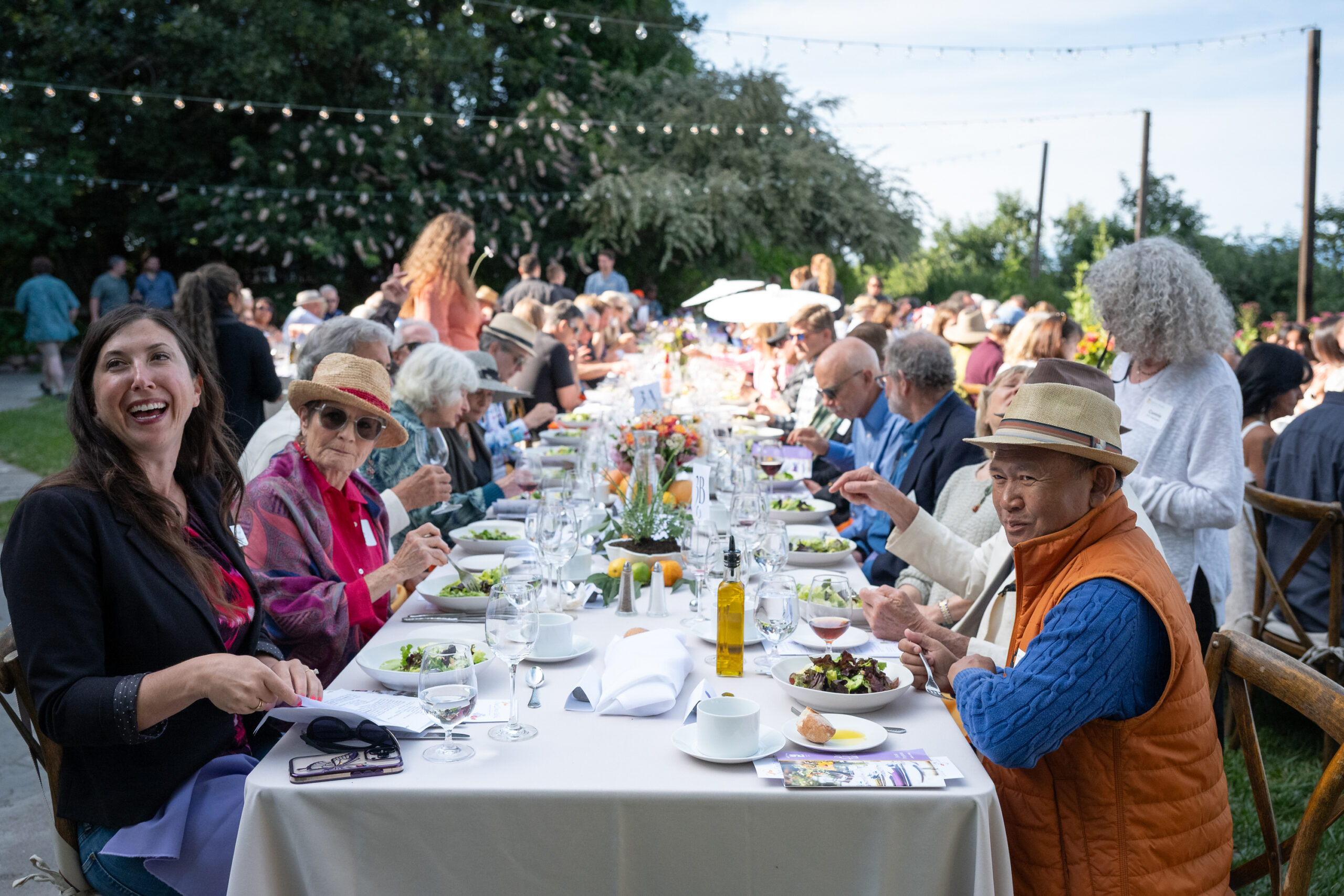 Guests of Our Long Table enjoying dinner