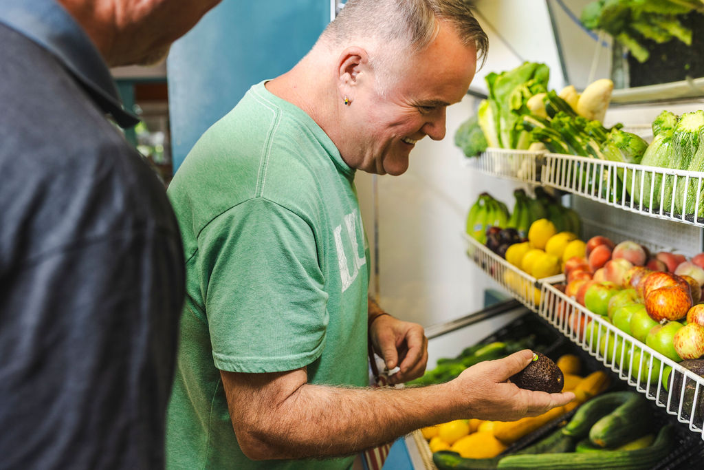 Client smiling while shopping in the food bank